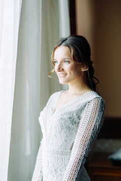 Bride fees at the hotel in the European style. Boudoir photo shoot and wedding dress.