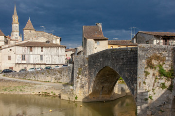 Fototapeta premium Nerac France 10-17-2018. Old houses and bridge in the city of Nerac in France.