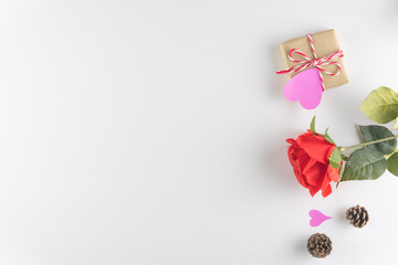 Gift box and red rose flower isolated on white wooden texture background, Happy valentine's day. holiday background, Flat lay, top view, copy space