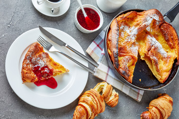 dutch baby pancake sprinkled with powdered sugar