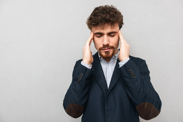 Sad young businessman wearing suit