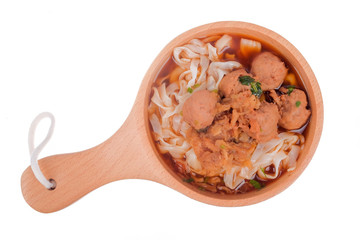 Delicious homemade Bakso, famous traditional Indonesian street food, meatballs with noodles served with chili saucel and soy sauce isolated on white background