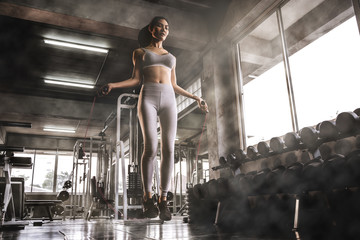 Sexy Asian women are jumping rope in the gym, exercise ideas, weight loss, muscle building.