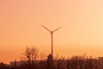 Fototapeta na wymiar wind turbines at sunset or sunrise