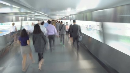 Anonymous Crowds of Asian People Walking on Elevated Walkway in City