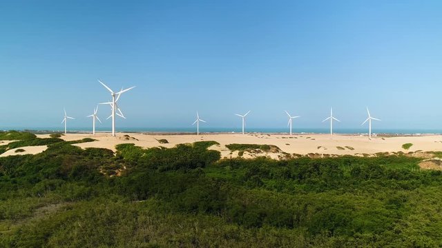 Aerial view of wind turbines on the top of dunes, Brazil.