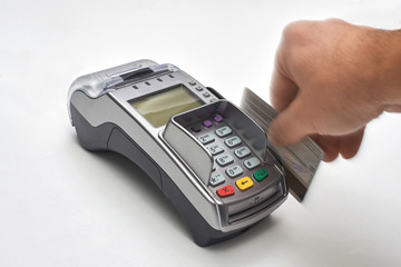 Businessman using payment terminal to pay with credit card.