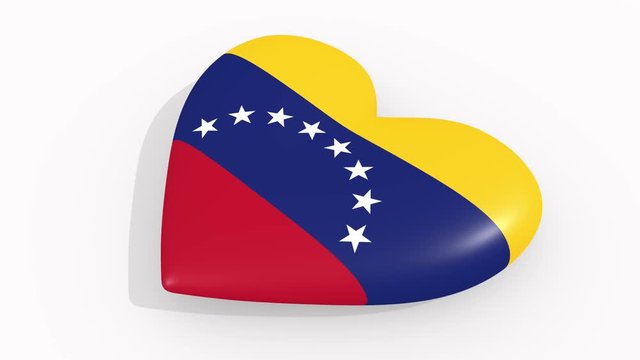 Heart in colors and symbols of Venezuela on white background, loop