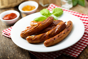 Grilled sausages with tomato sauce