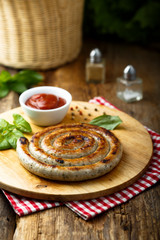 Grilled sausage with tomato sauce
