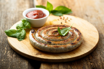 Grilled sausage with tomato sauce