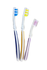 Toothbrushes and tube on white background