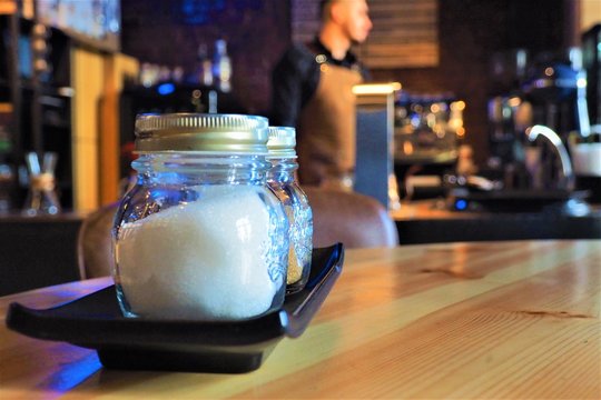 Glass jars with sugar in a coffee shop