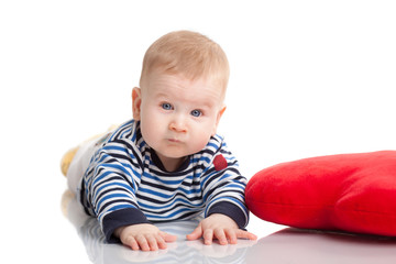portrait of a cute baby boy with red head smiling on white background isolated