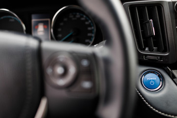 Luxury prestige car interior, dashboard, steering wheel.