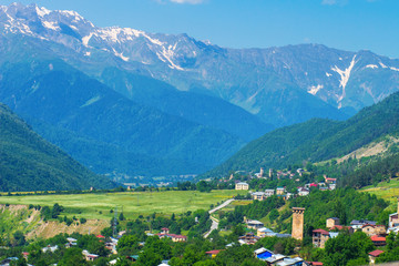 Fototapeta na wymiar View on Mestia village in Svaneti valley near mountain range.