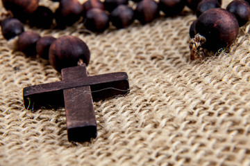 Close up rosary as symbol of salvation and eternal life. Religion tradition.