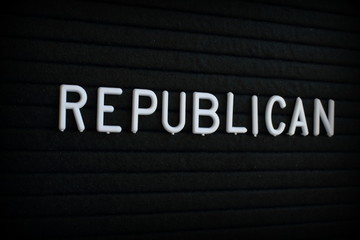 The word Republican in white plastic letters on a black letter board