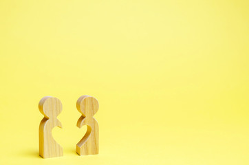 Two wooden man with half a heart. Search for a soul mate. Flirt and sympathy. Human relations. Love...