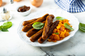 Grilled sausages with roasted pumpkin