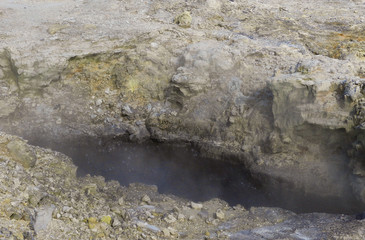 Black boiling mud pool