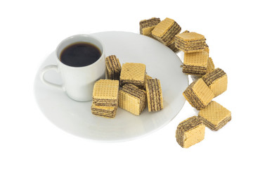 A cup of coffee and wafer cube