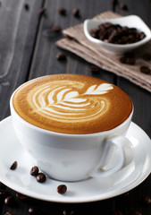 Delicious coffee drink on wooden tabletop
