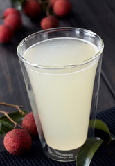 Delicious drink, lychee juice. On wooden table