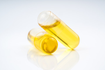 Olive capsule with white background.