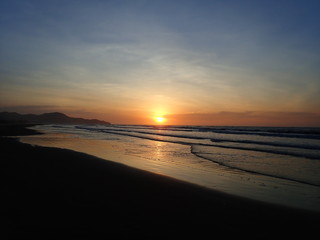 Fototapeta na wymiar The beautiful and stunning sunset view along the seashore.