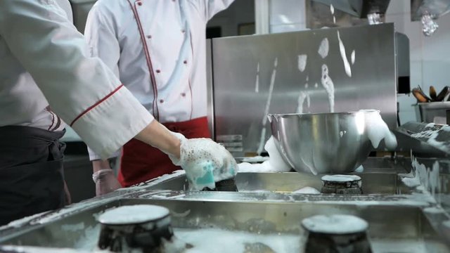 Sanitary day. Cooks wash oven, stove and extractor in the restaurant