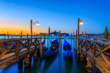 Sunrise in San Marco square, Venice, Italy. Architecture and landmarks of Venice. Venice postcard with Venice gondolas