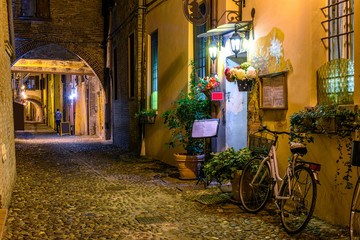 Cozy street with old houses in Ferrara, Emilia-Romagna, Italy. Ferrara is capital of the Province...