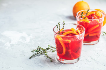 Blood Orange Margarita cocktail with ice and thyme