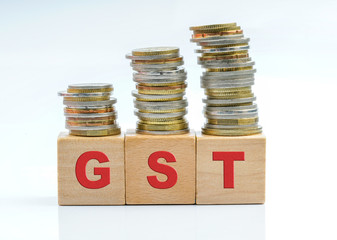 Coins and wooden with tax GST.