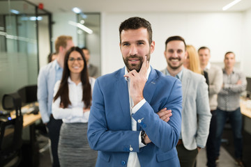 Portrait of business team posing in office