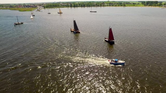 Aerial of typical Dutch blunter ships with on the background fishers village Spakenburg, The Netherlands