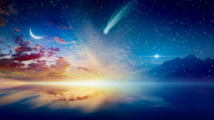 Crescent moon, glowing horizon, bright stars and comet © IgorZh