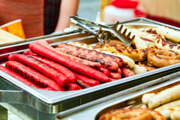 Closeup shot of sausages on the metal tray