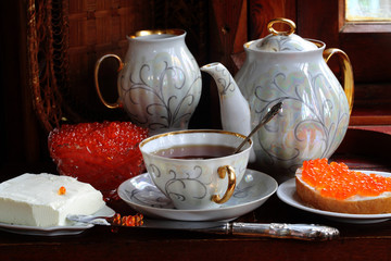 Coffee service and red caviar sandwiches