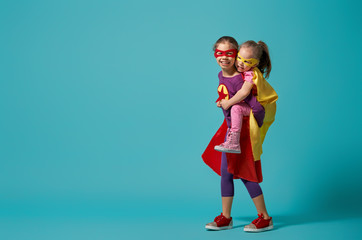 children playing superhero - obrazy, fototapety, plakaty
