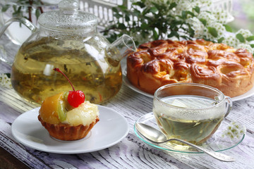 A bouquet of sunflowers and tea with honey
