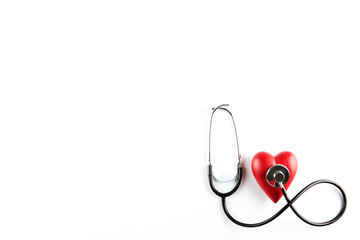 Heart disease awareness and prevention concept. Stethoscope and red heart on white isolated...