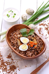 Porridge with mushrooms and quail eggs