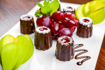 Candy with chocolate and berries