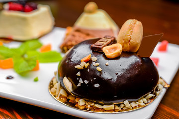 An assortment of white, dark, and milk chocolate with nuts, muffins, macaroons