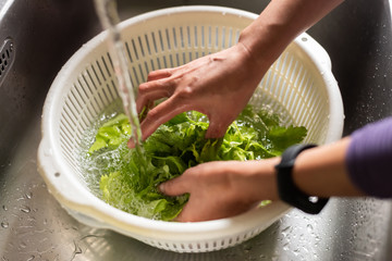woman washing vegetables