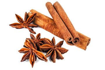 cinnamon sticks and anise stars on white