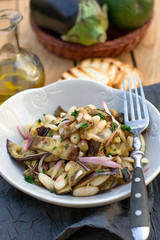 Salad with fried eggplant, haricot beans, onions