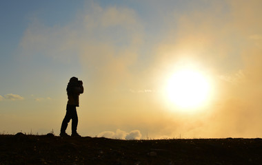 A young woman standing on mountain
